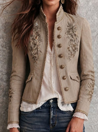 Veste rétro beige à col montant avec broderie florale et garniture tressée